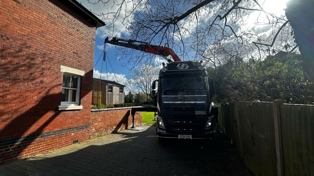 Tight-access residential shed lift with Volvo HIAB