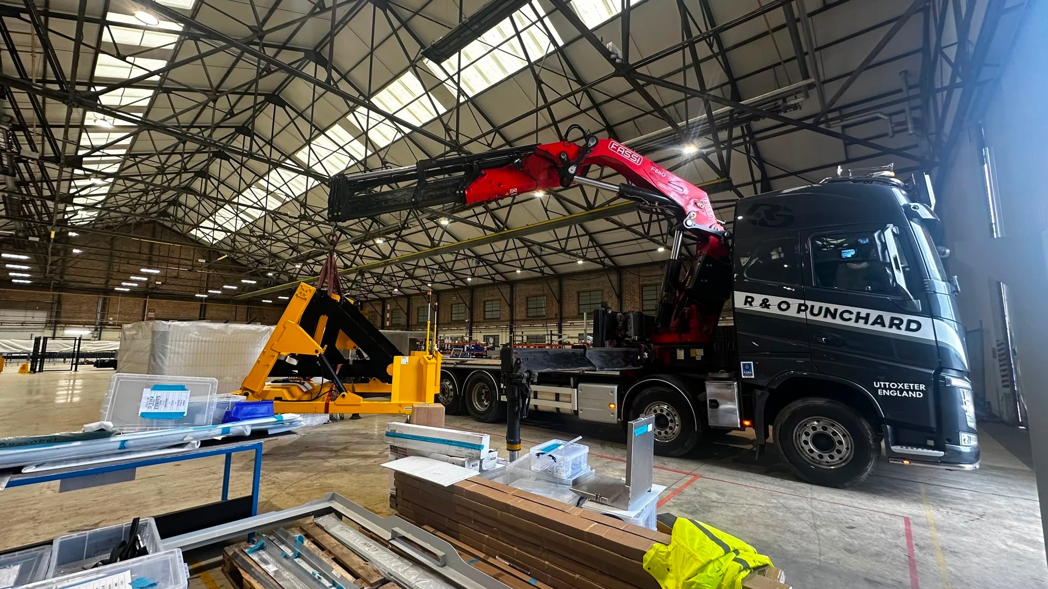R & O Punchard branded crane truck lifting inside a warehouse