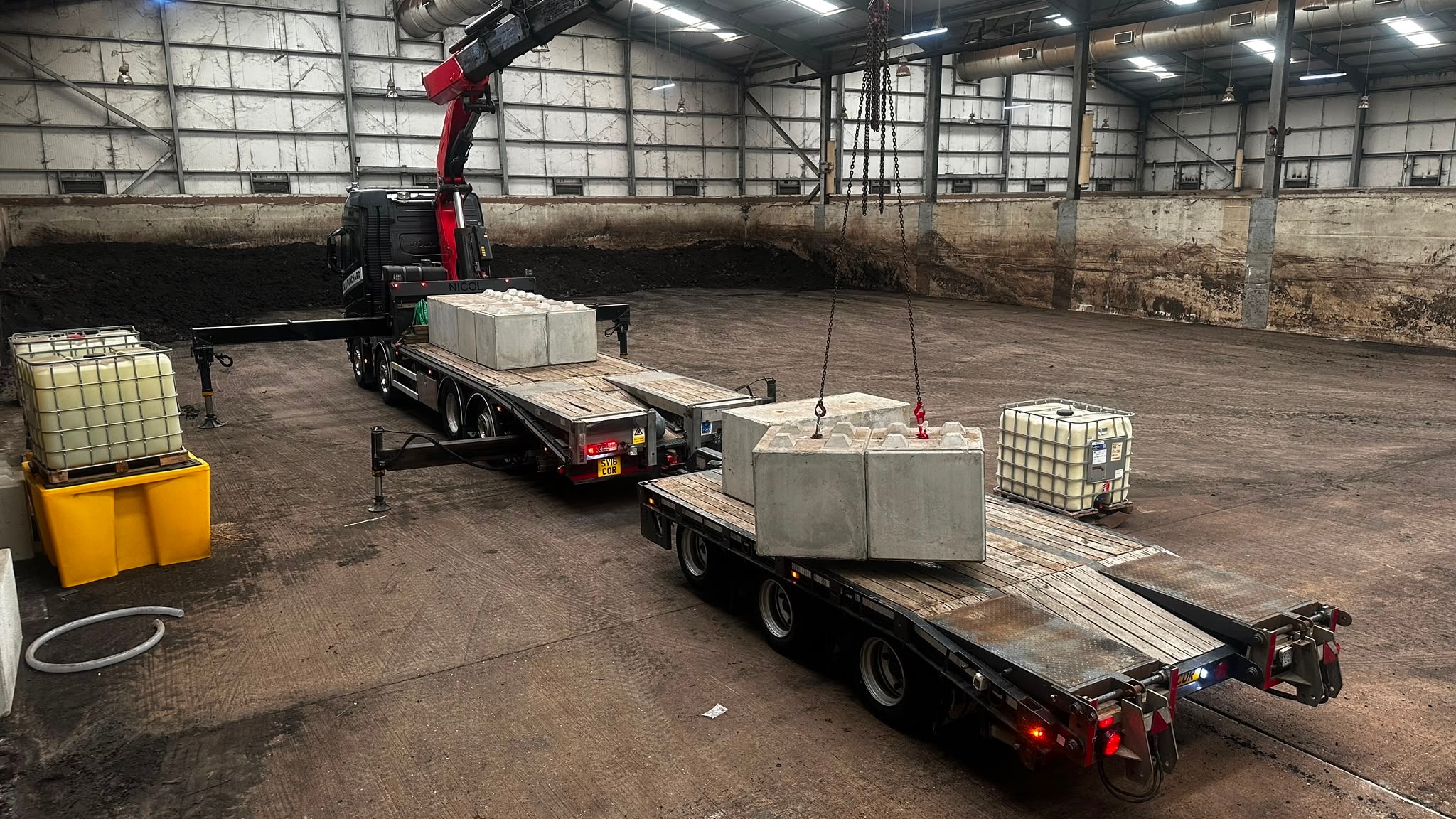 Concrete block loading inside an industrial warehouse